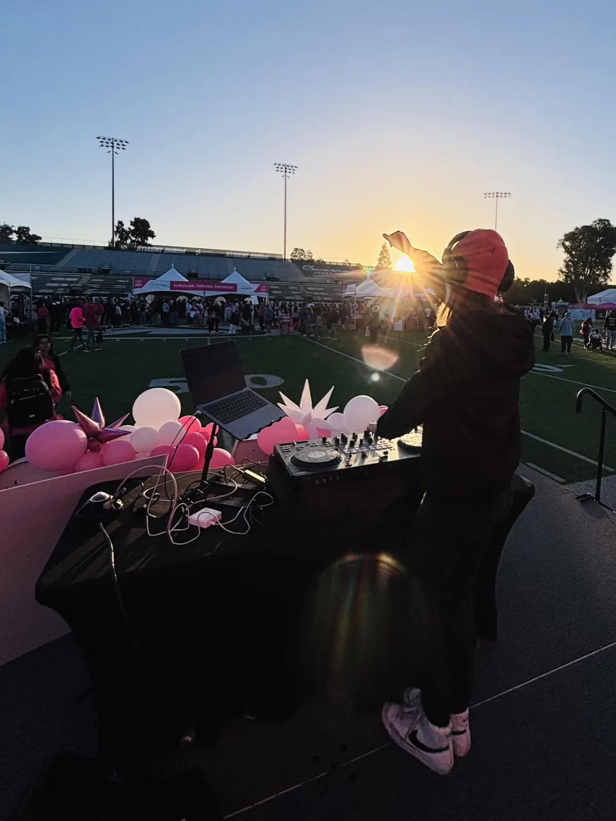 DJ Lyndsay Brown playing at sunset at Sacramento State's Hornet Stadium