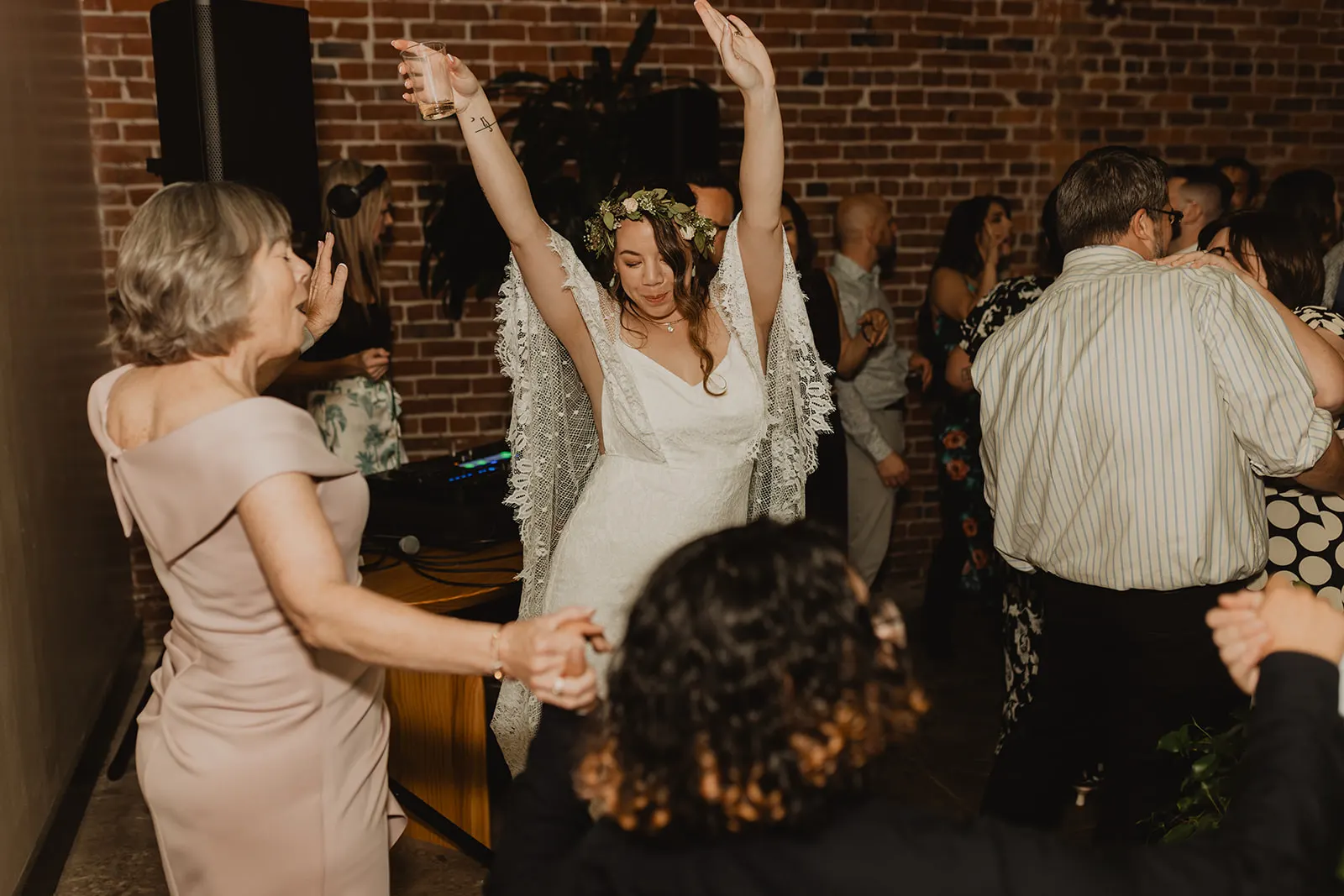 The bride dancing with her guests on a wedding dance floor DJ Lyndsay Brown played
