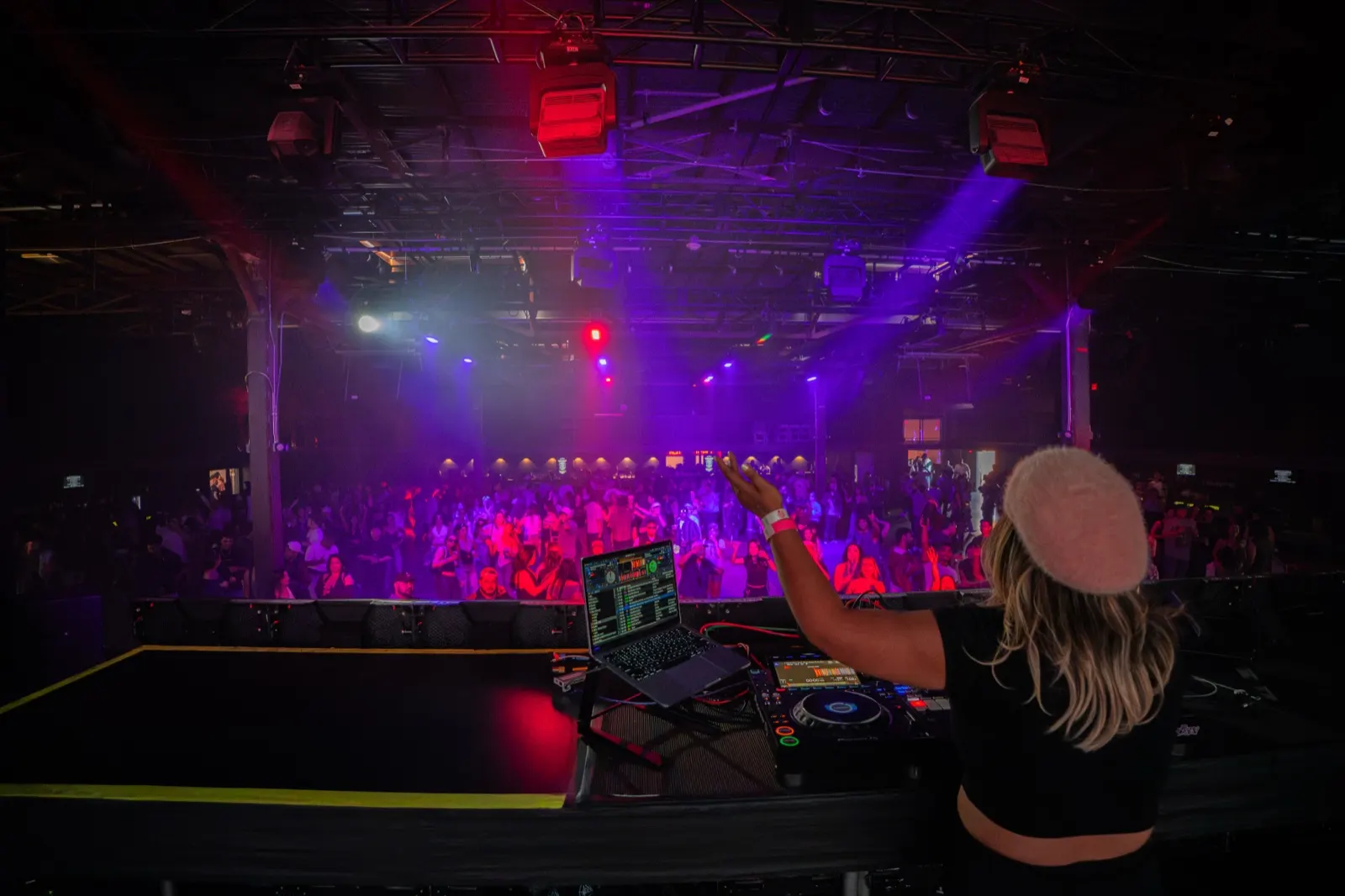 DJ Trixy playing to a packed floor at R&B and Ribs, The Midway, San Francisco